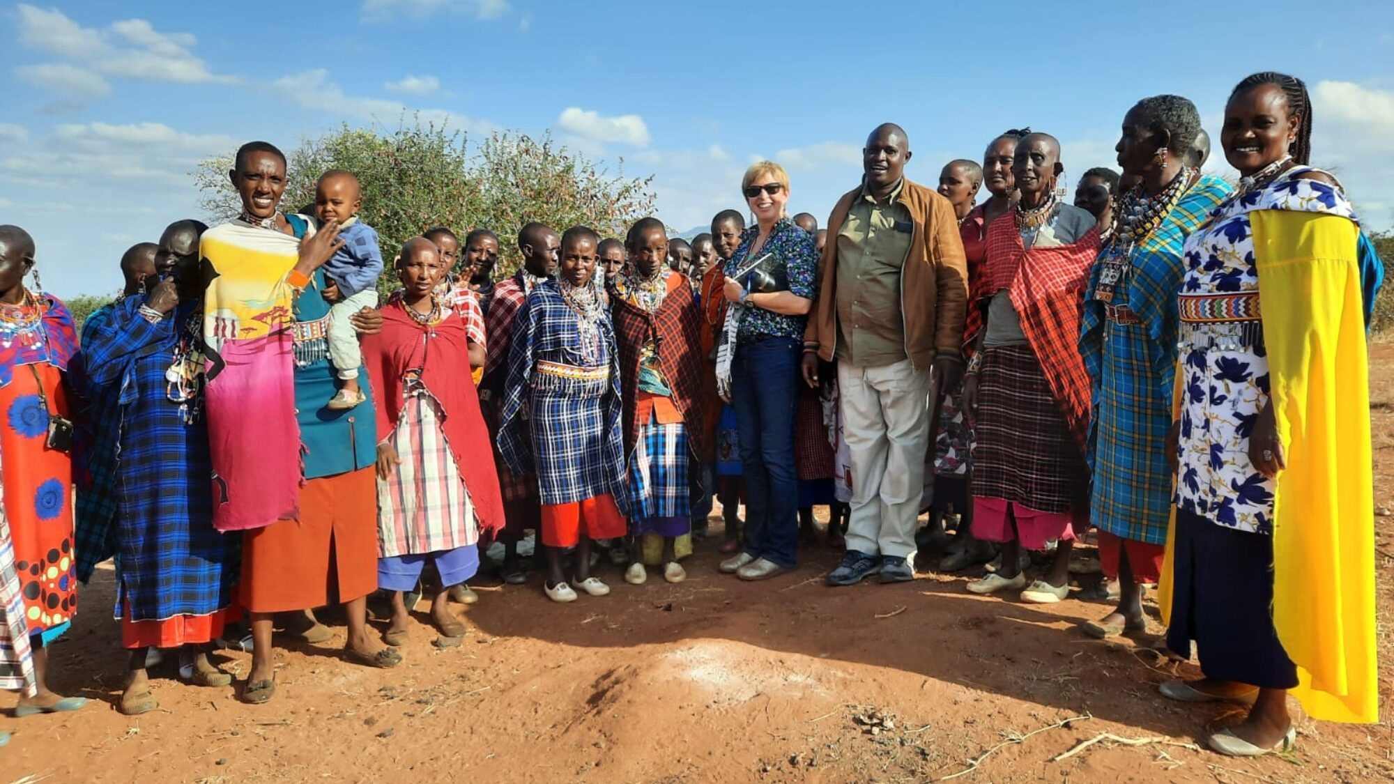 WILK Co-Founder Joyce Tannian gathers with members of the Lositeti community borehole.