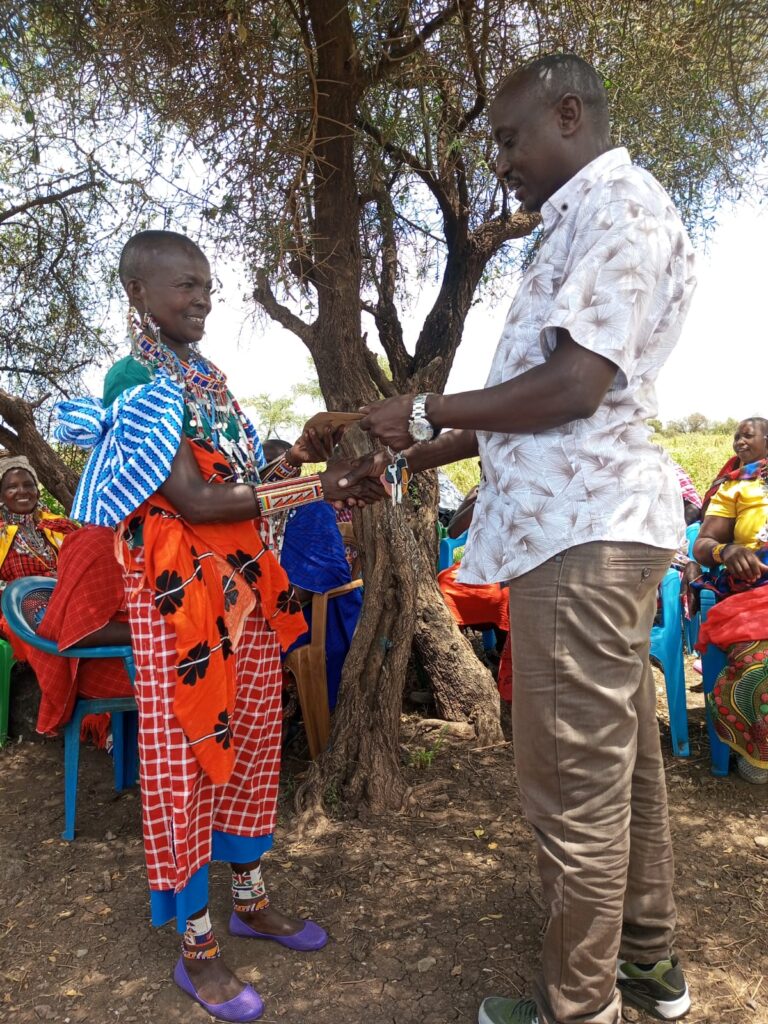 a widow winning the savings competition in Kenya