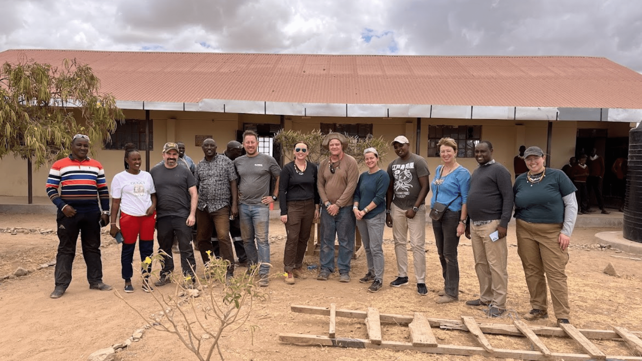 The WILK-TEC team in front of the third building they worked on.